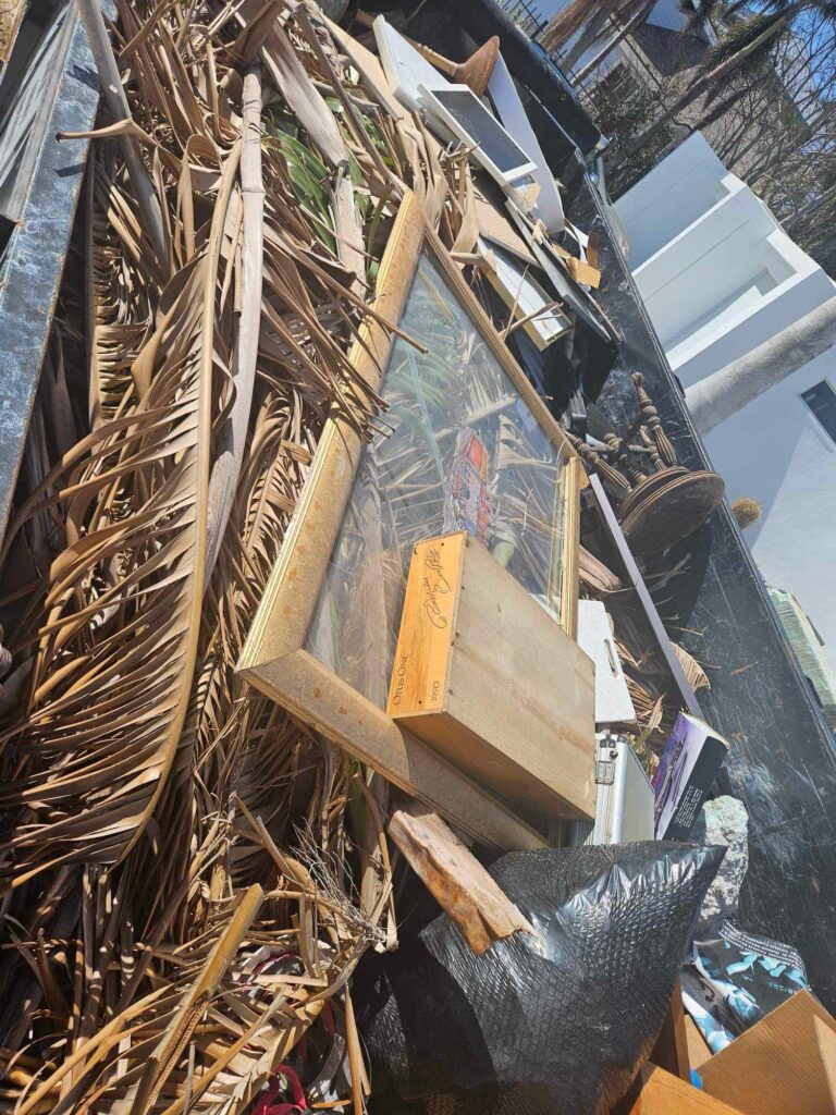 A pile of debris and wood on top of the ground.